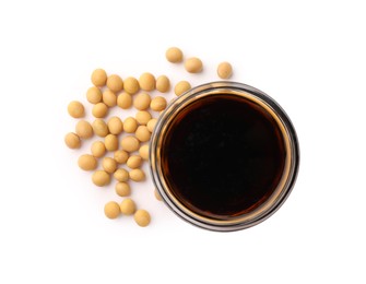 Photo of Bowl of soy sauce and soybeans isolated on white, top view