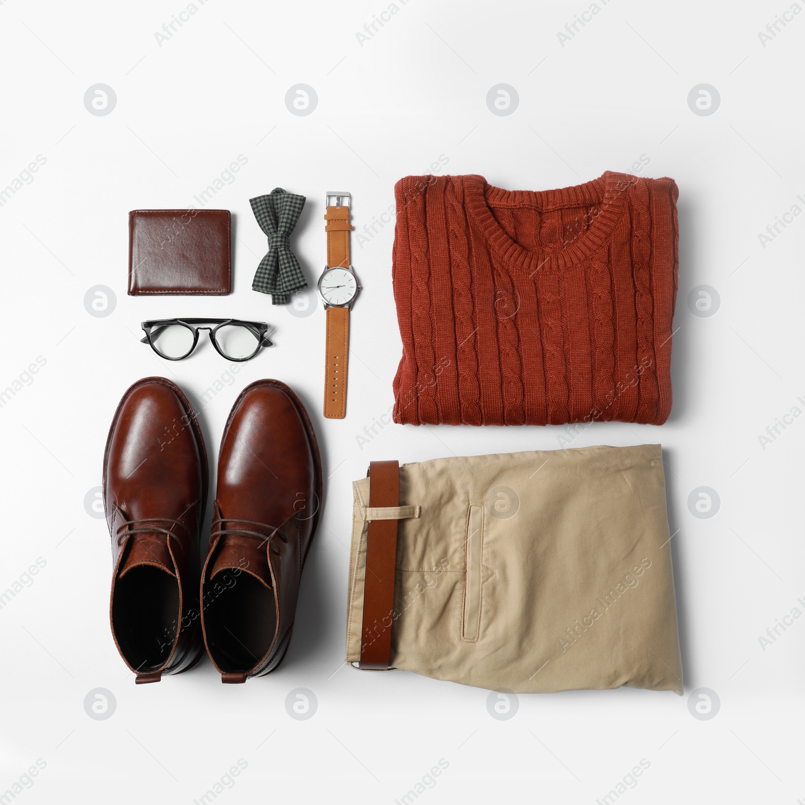 Photo of Stylish male autumn outfit and accessories on white background, flat lay. Trendy warm clothes