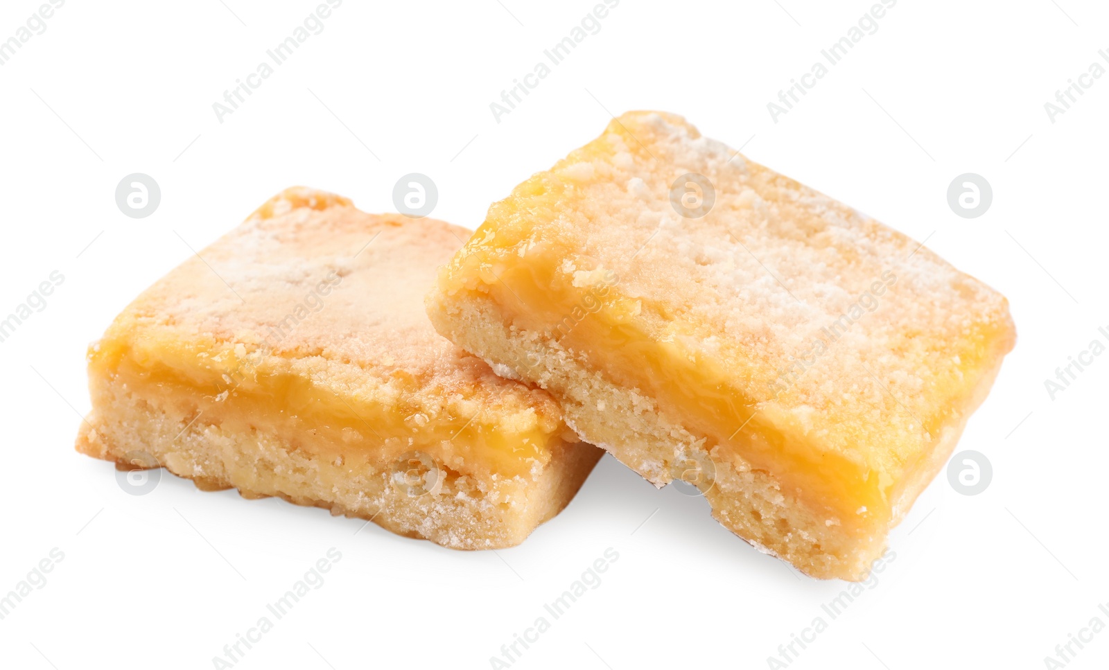 Photo of Tasty lemon bars with powdered sugar isolated on white