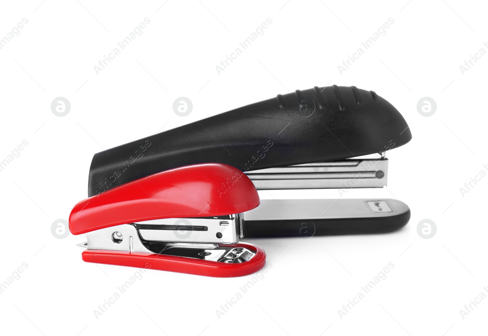 Photo of New bright color staplers isolated on white