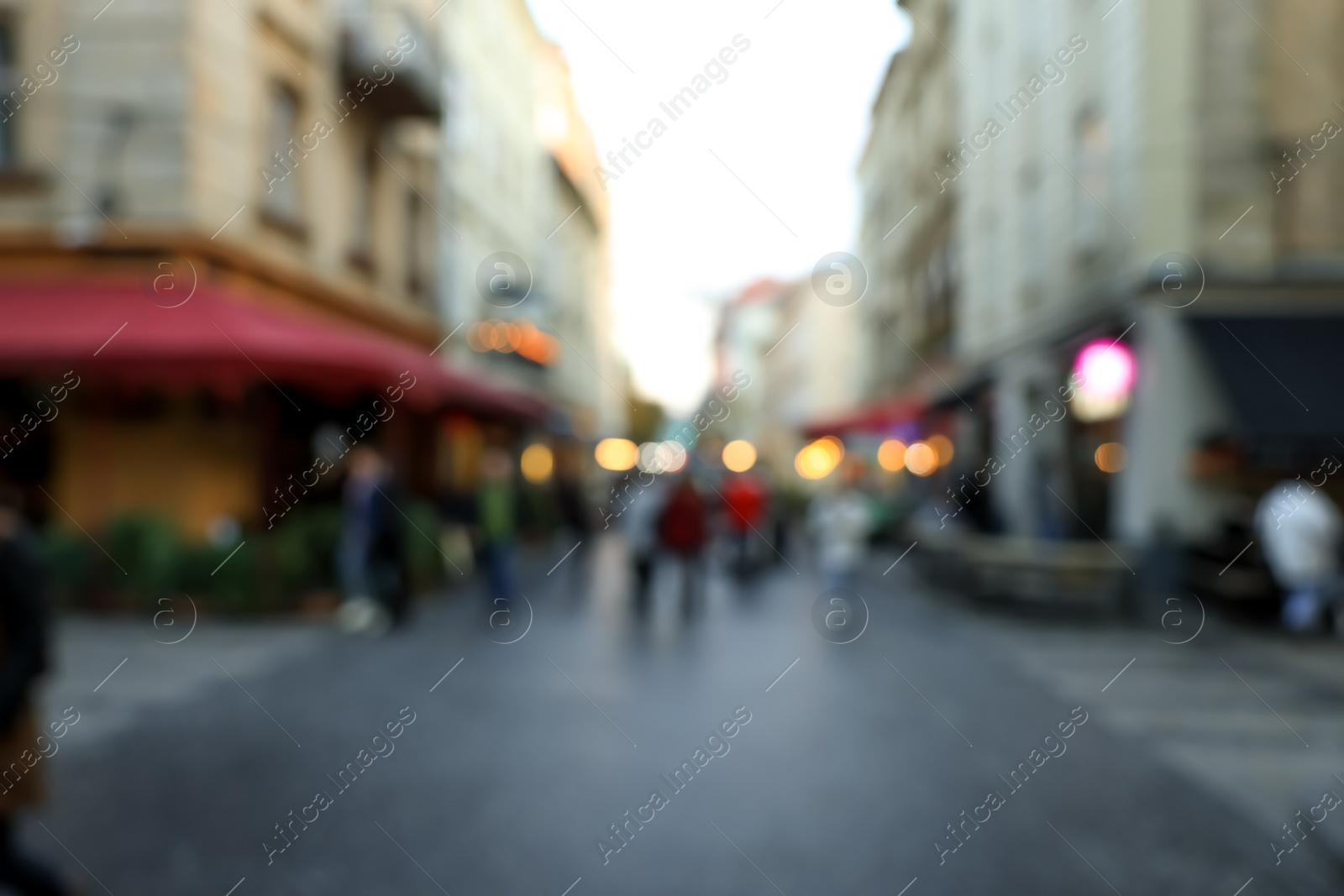 Photo of Blurred view of people walking on city street