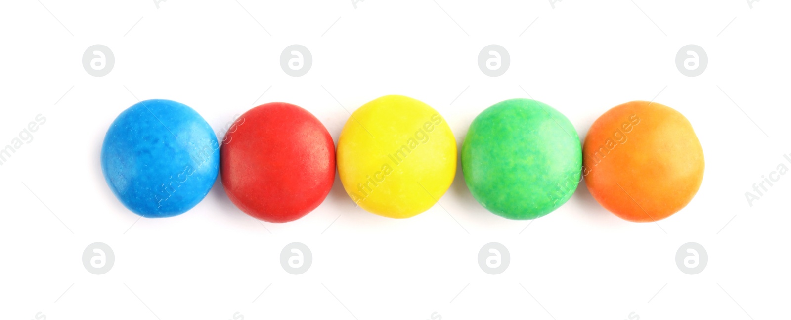 Photo of Tasty colorful candies on white background, top view