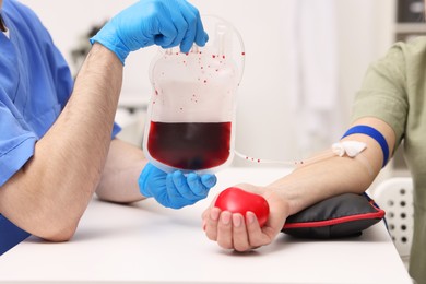 Photo of Patient undergoing blood transfusion in hospital, closeup