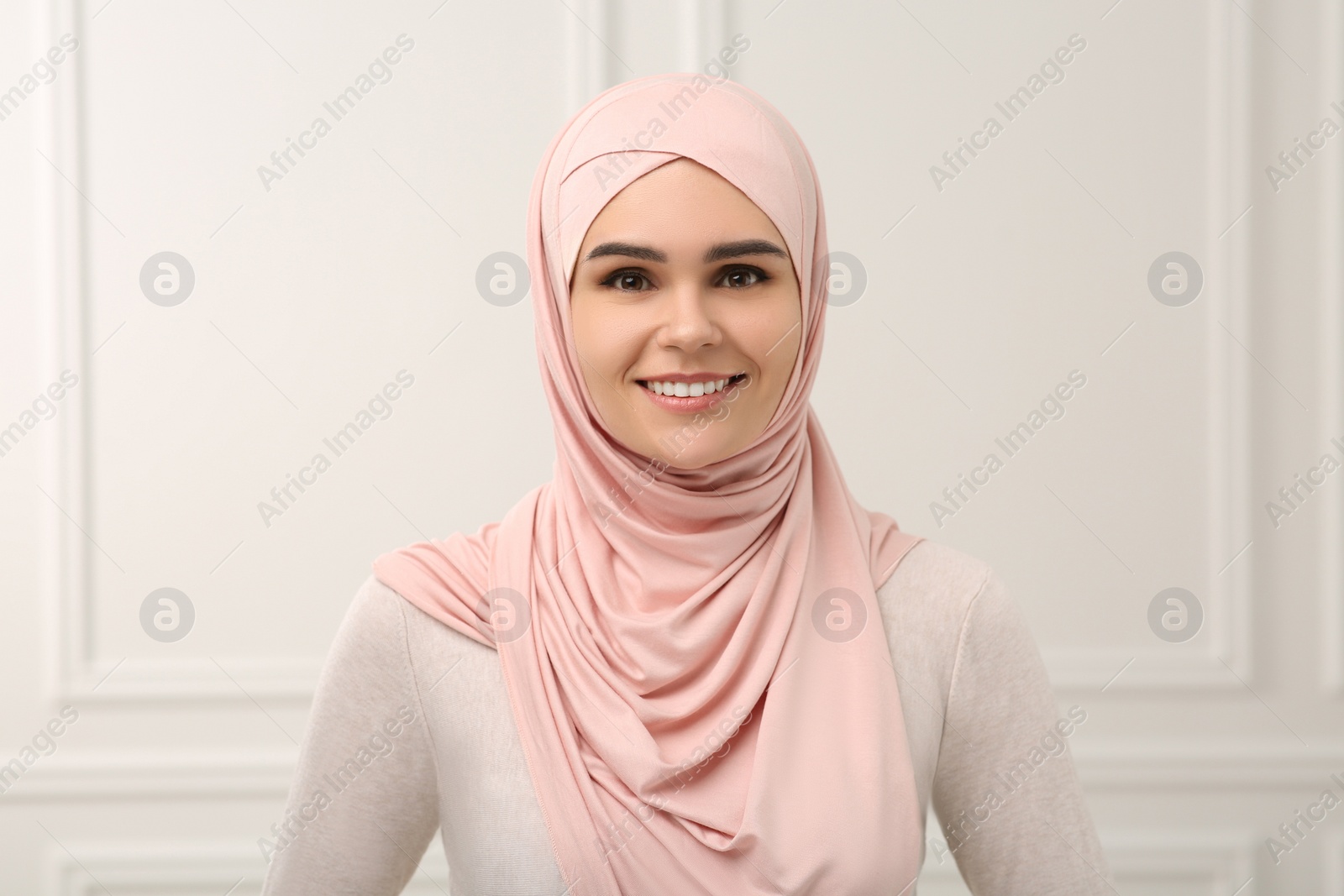 Photo of Portrait of Muslim woman in hijab indoors