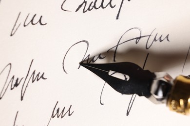 Photo of Writing letter with elegant fountain pen, closeup