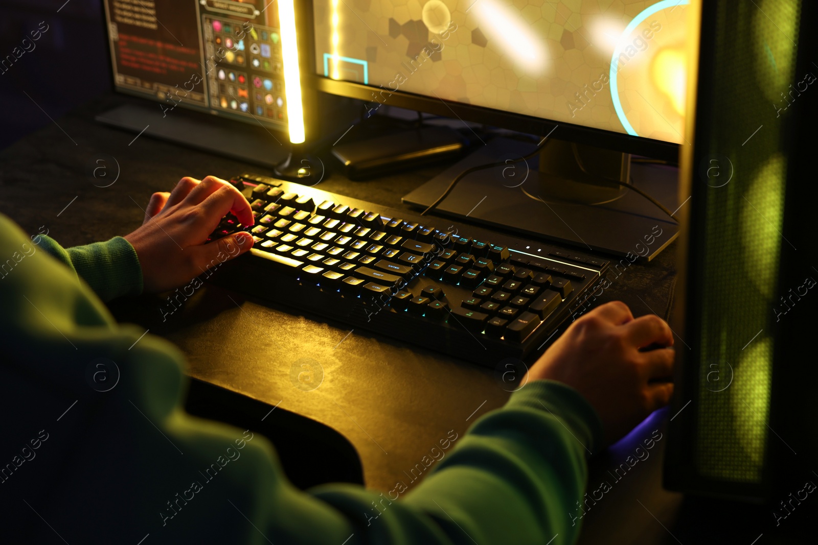 Photo of Man playing video games on computer indoors, closeup