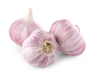 Photo of Fresh raw garlic heads isolated on white