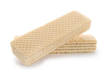 Photo of Delicious vanilla wafer sticks isolated on white