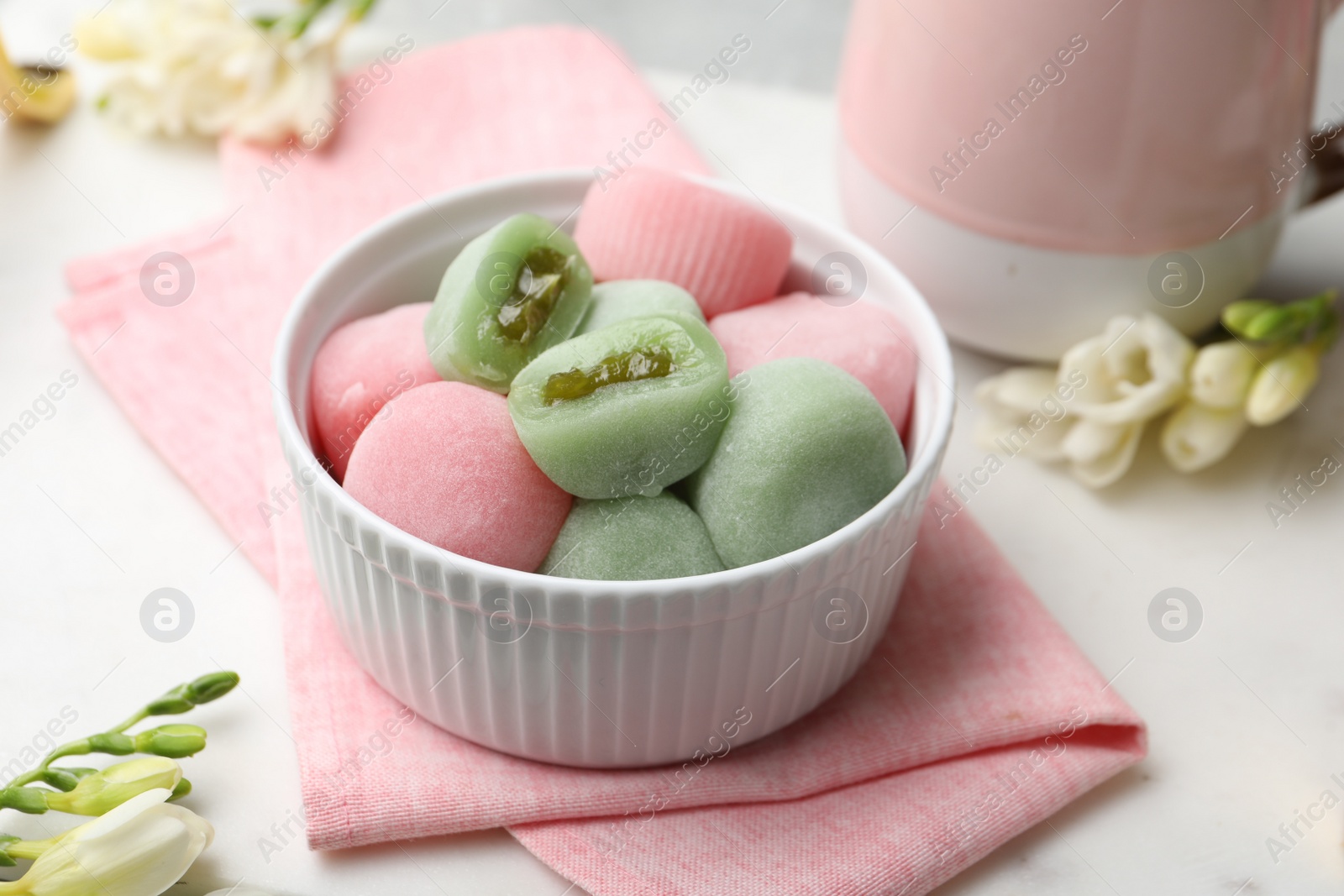 Photo of Delicious mochi in bowl on table. Traditional Japanese dessert