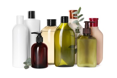 Photo of Different bottles of shampoo on white background