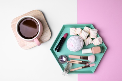 Flat lay composition with drink, sweets and cosmetics on color background