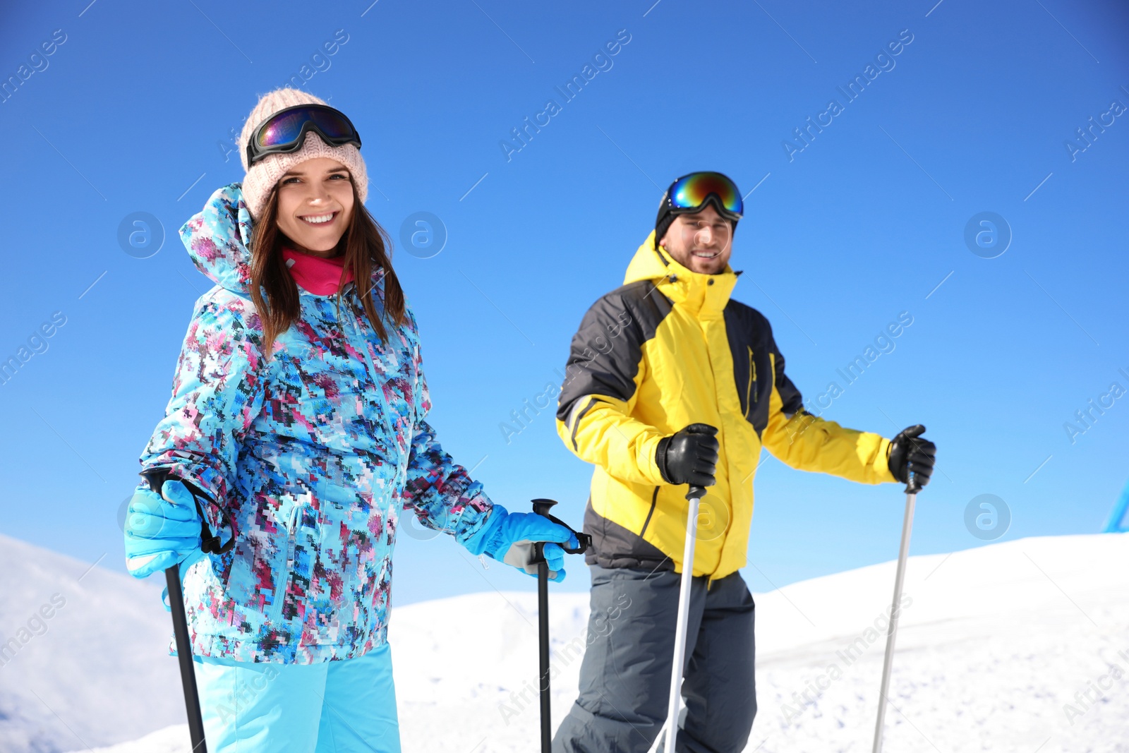 Photo of Young couple skiing on hill. Winter vacation