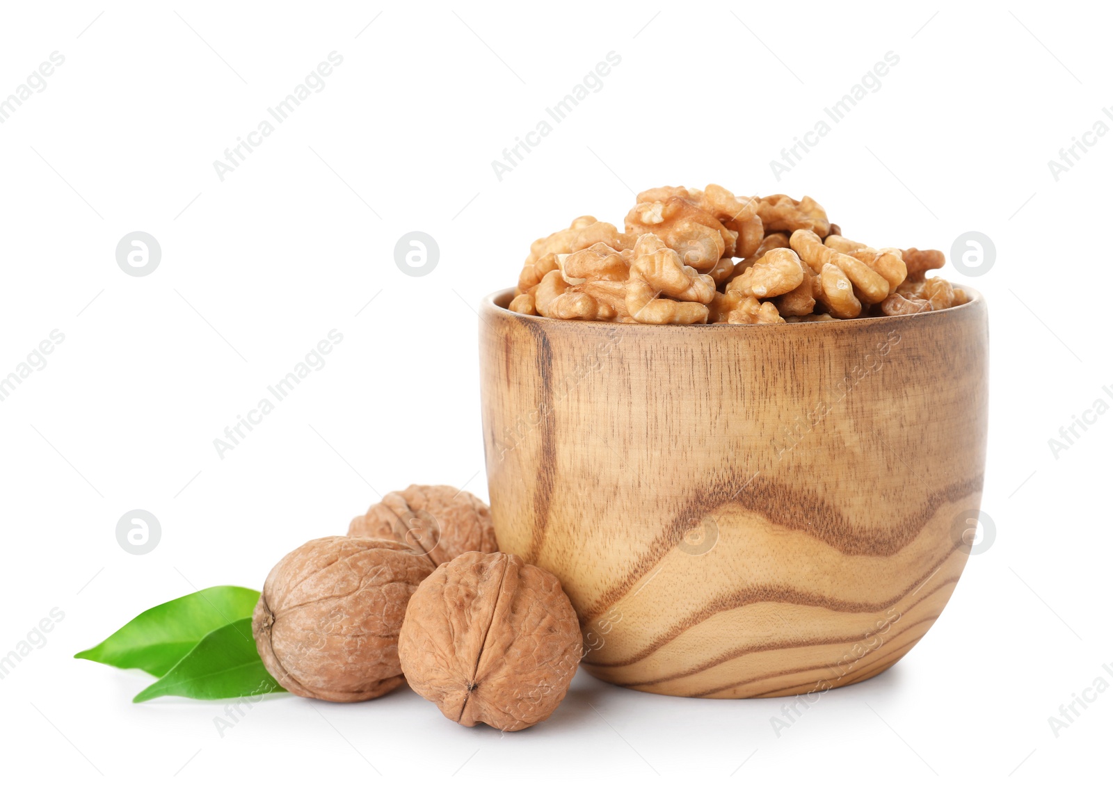 Photo of Bowl with tasty walnuts on white background