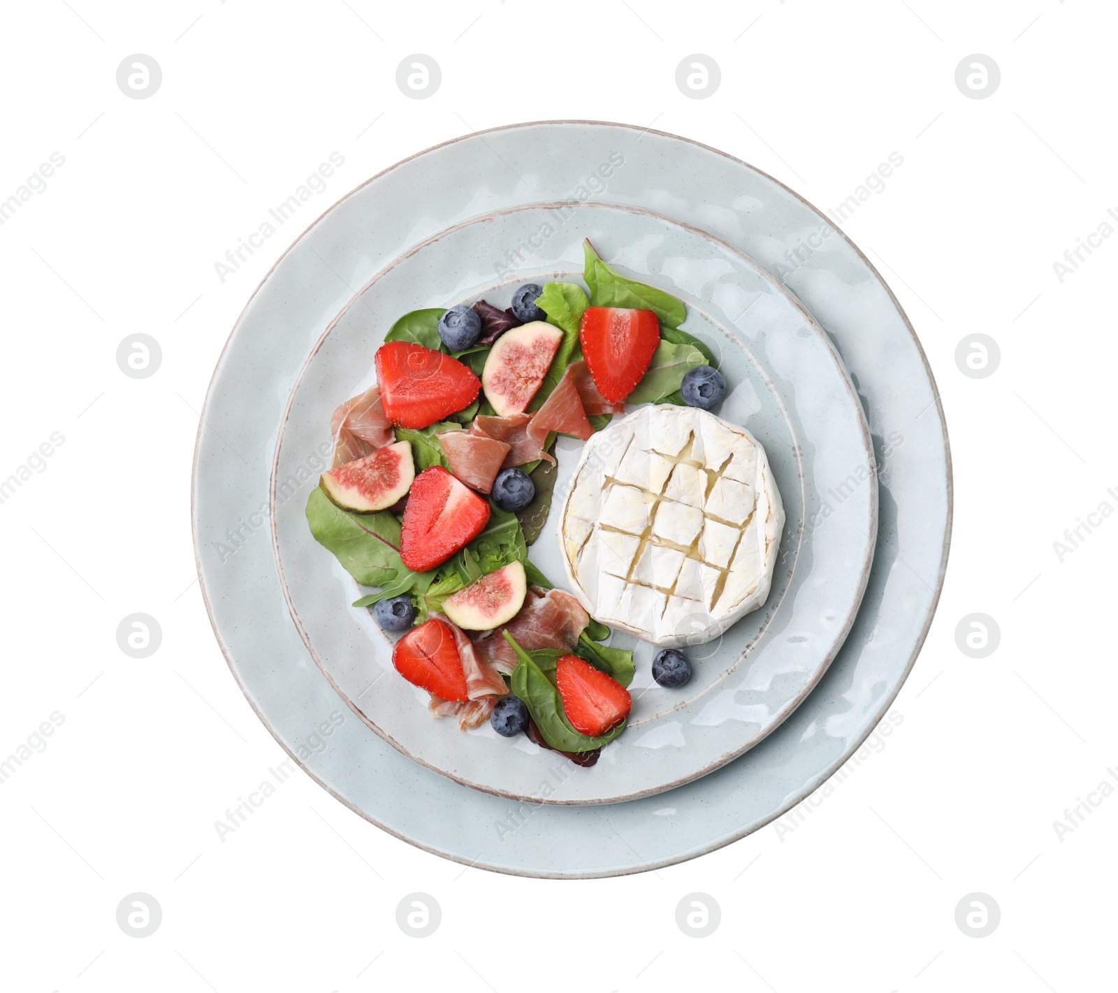 Photo of Delicious salad with brie cheese, prosciutto, figs and strawberries on white background, top view