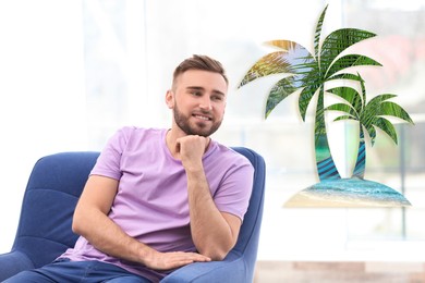 Image of Young man dreaming about vacation at home