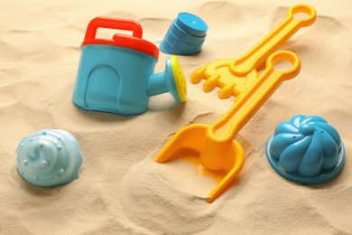 Colorful beach toy kit on sand. Outdoor play