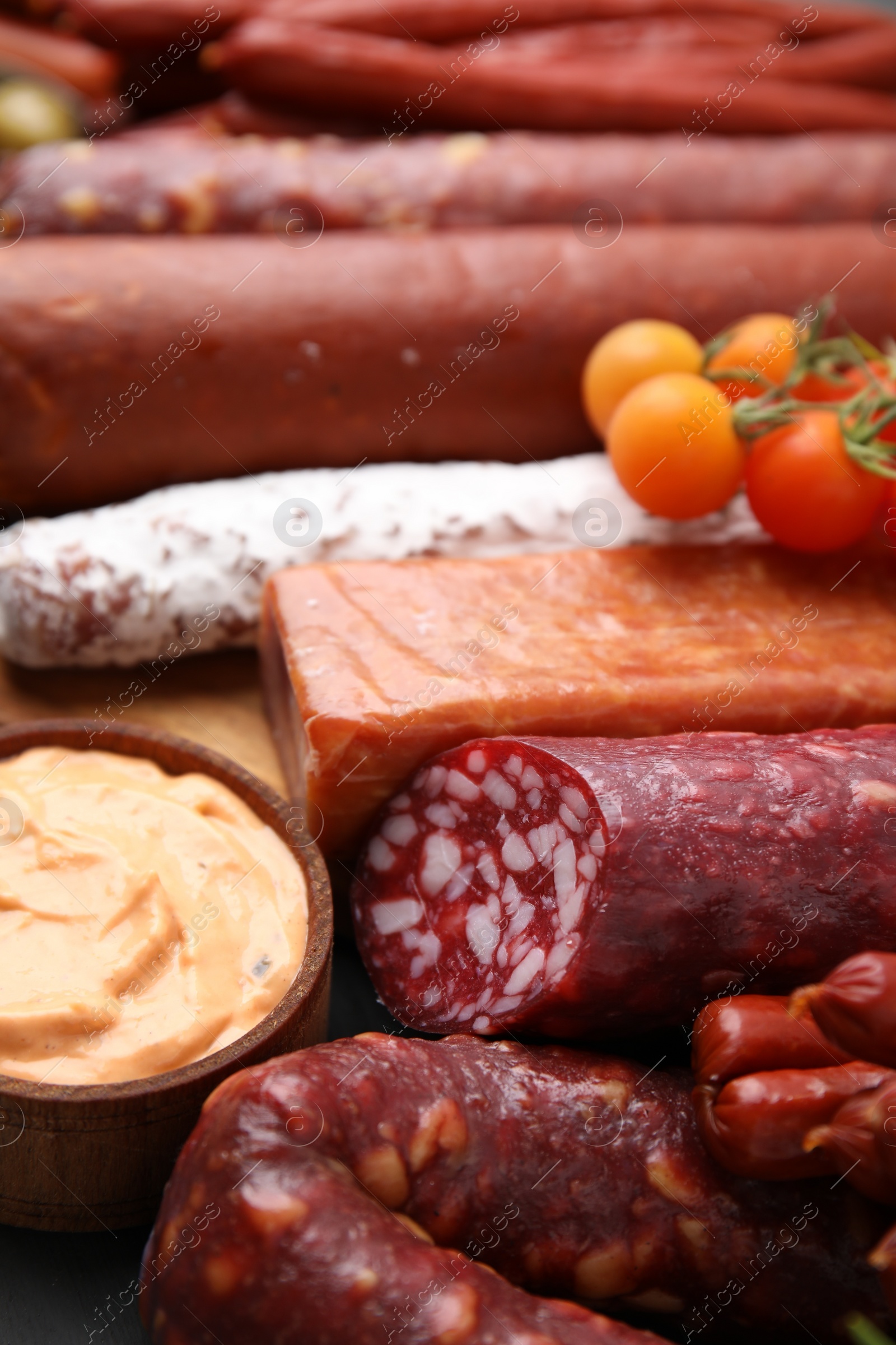 Photo of Different types of tasty sausages on table, closeup