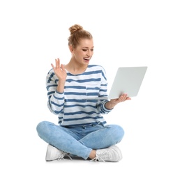 Photo of Beautiful young woman using laptop on white background