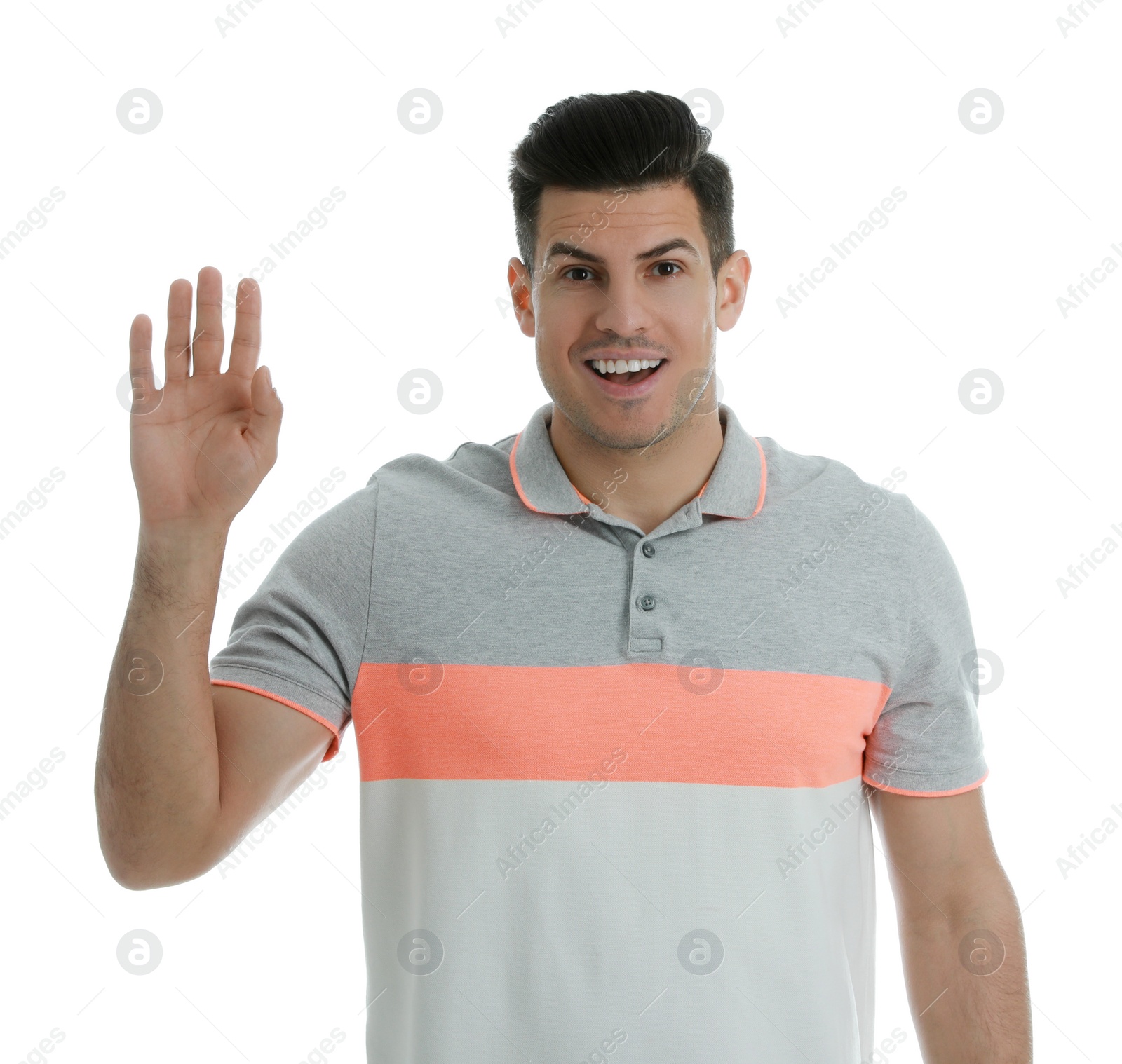 Photo of Cheerful man waving to say hello on white background