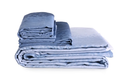 Stack of clean bed linen isolated on white