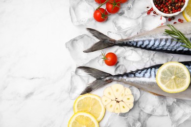 Photo of Flat lay composition with tasty raw mackerel on white marble table. Space for text