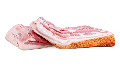 Photo of Pieces of raw pork belly isolated on white