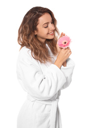 Beautiful young woman with flower wearing bathrobe on white background