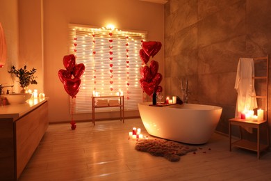 Photo of Stylish bathroom decorated for Valentine's day. Interior design