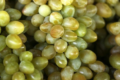 Fresh ripe juicy grapes as background, closeup