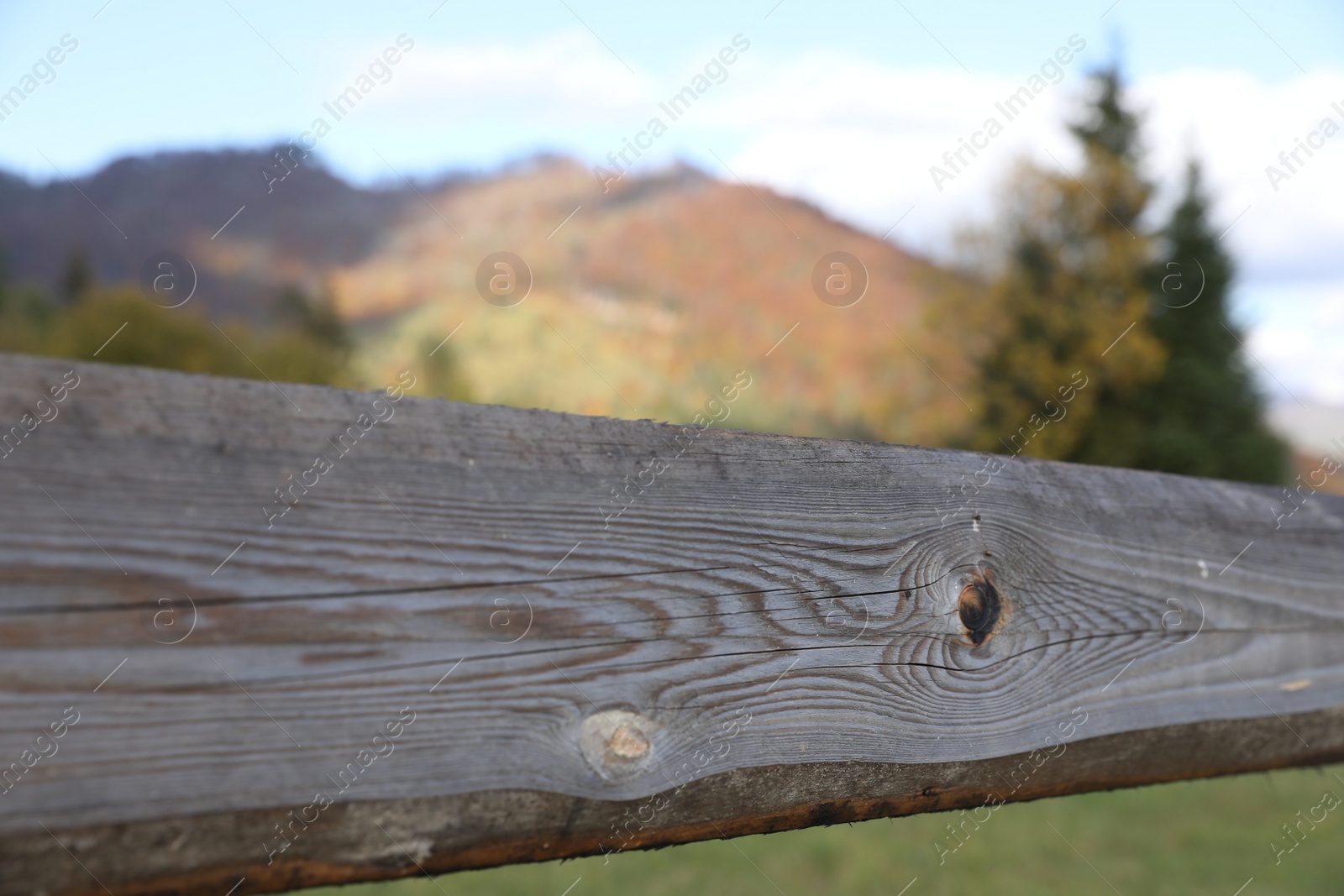 Photo of Closeup view of old wooden fence outdoors