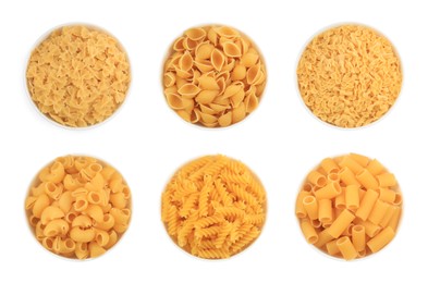 Image of Different types of pasta in bowls isolated on white, top view