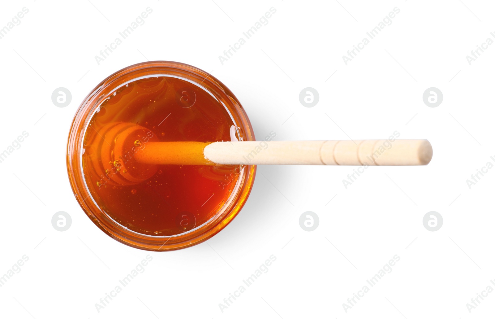 Photo of Tasty natural honey and dipper in glass jar on white background, top view