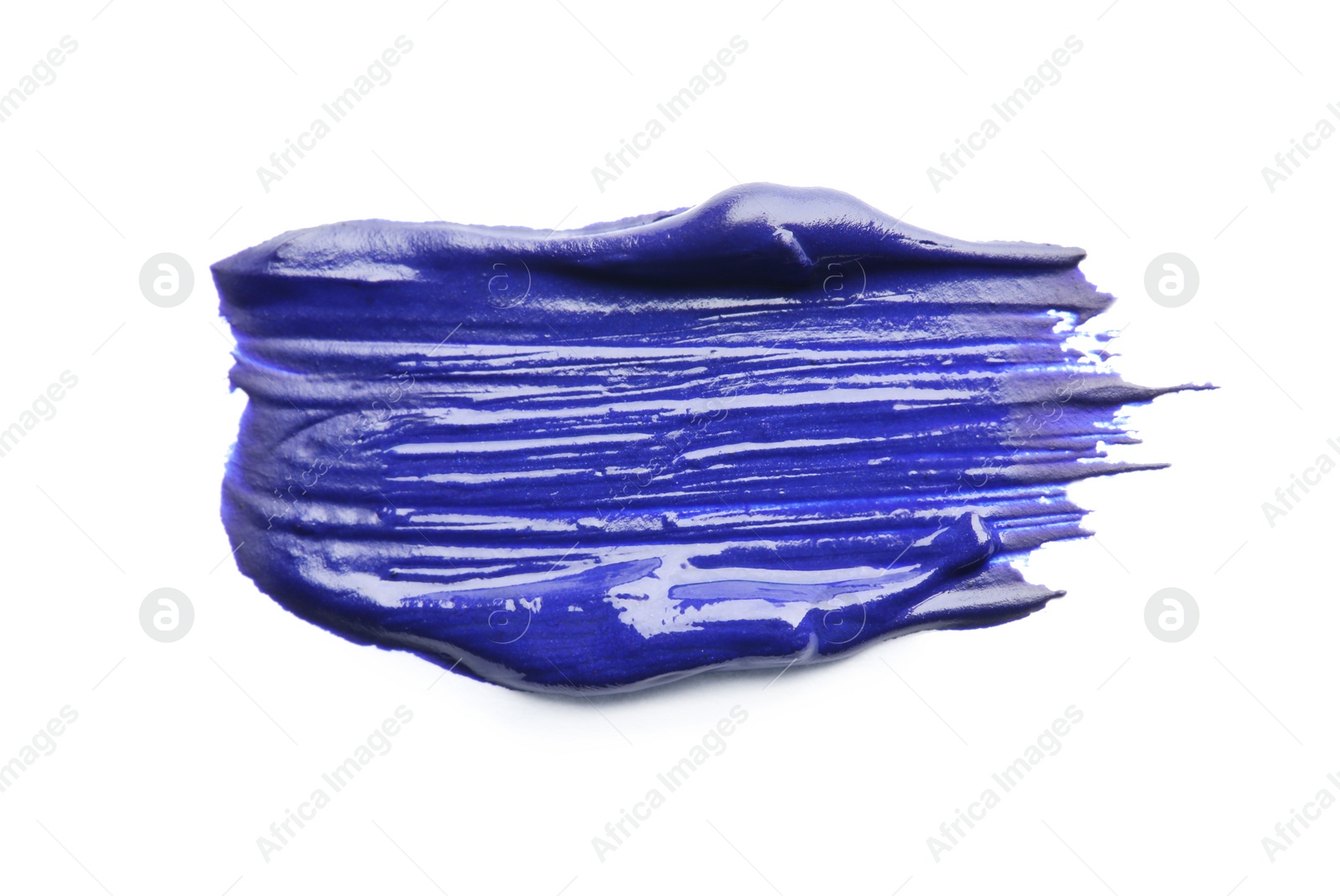 Photo of Abstract brushstroke of blue paint isolated on white