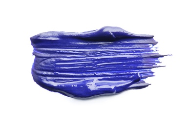 Photo of Abstract brushstroke of blue paint isolated on white