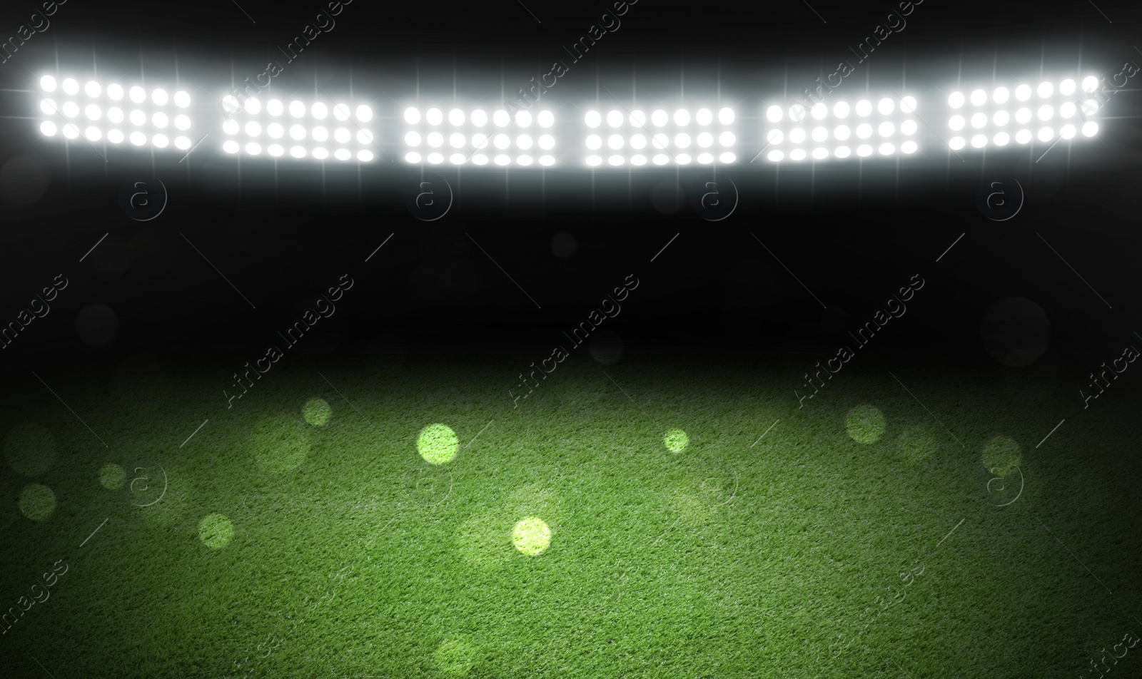 Image of Green sports field under stadium lights, bokeh effect. Banner design