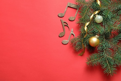 Flat lay composition with decorations and  notes on color background. Christmas music concept