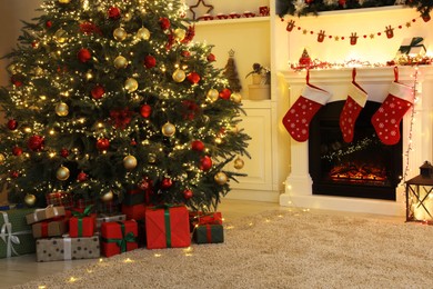 Photo of Living room interior with fireplace and festive decor. Christmas celebration
