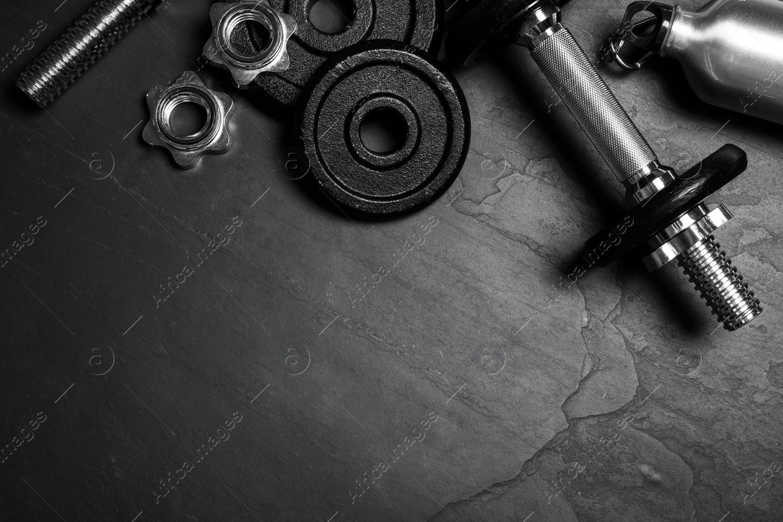 Gym equipment on black background, flat lay. Space for text Photo of Gym equipment on black background, flat lay. Space for text