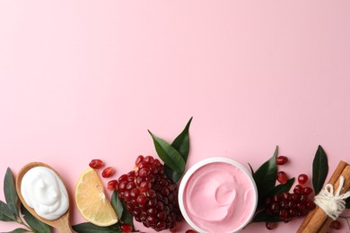 Flat lay composition with natural homemade mask, pomegranate and ingredients on pink background. Space for text