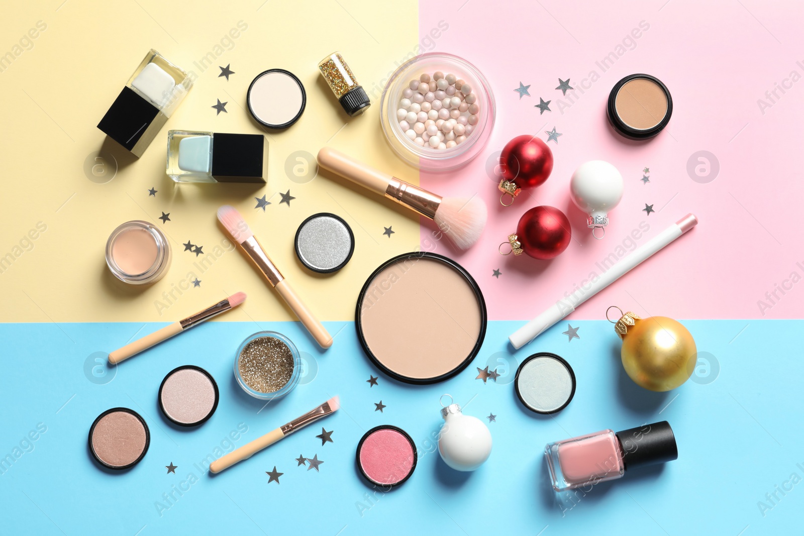 Photo of Flat lay composition with makeup products and Christmas decor on color background