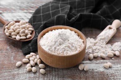 Bean flour and seeds on wooden table