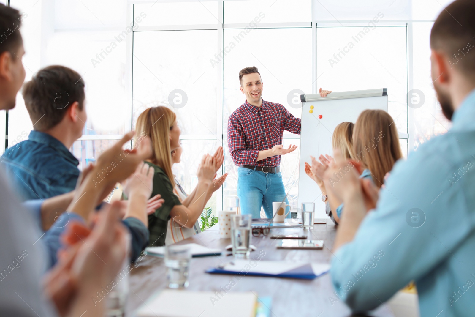 Photo of Male business trainer giving lecture in office