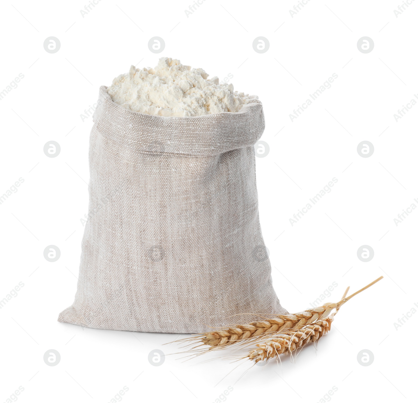 Photo of Sack with flour and wheat spikes on white background