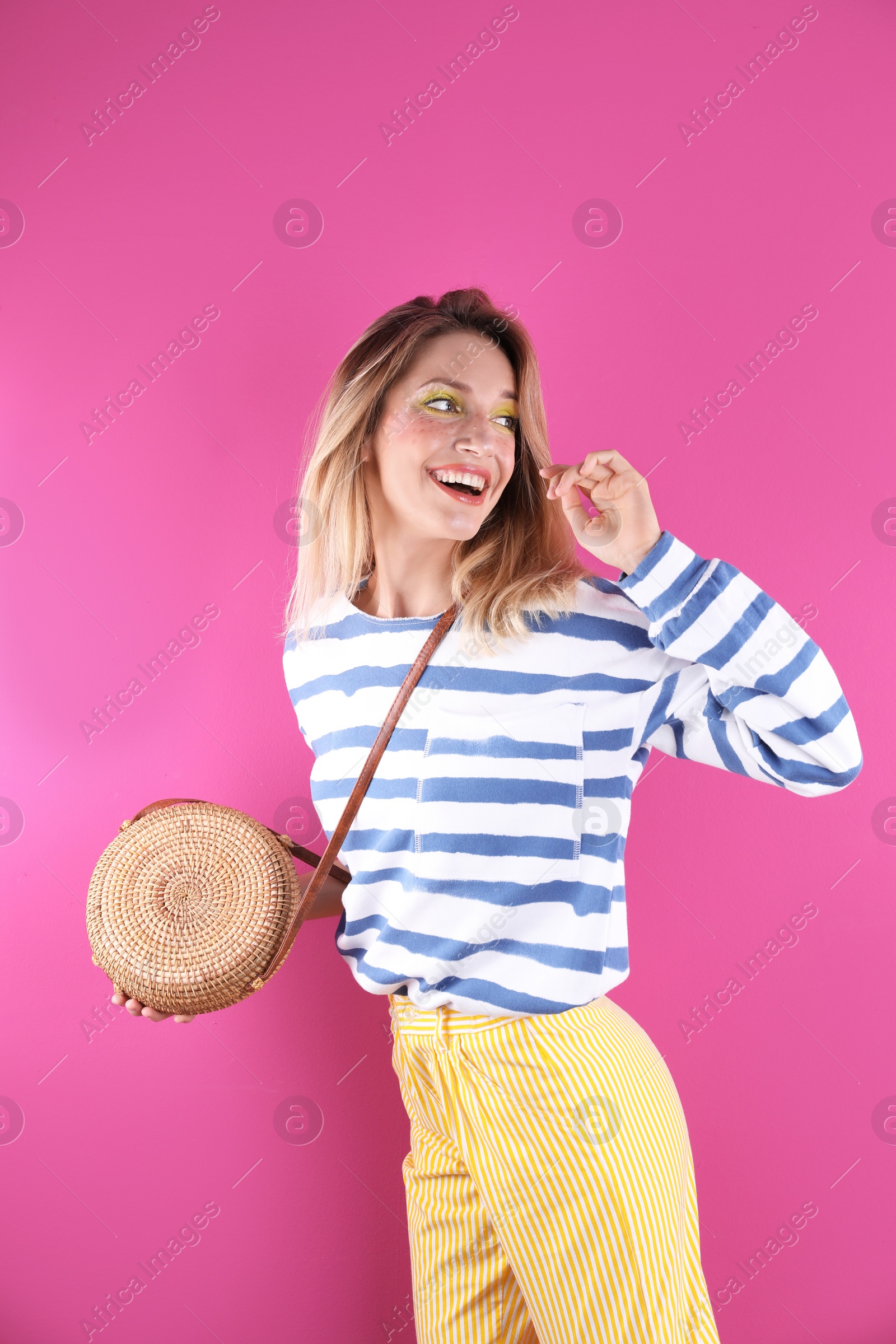 Photo of Beautiful young woman posing on color background. Summer fashion