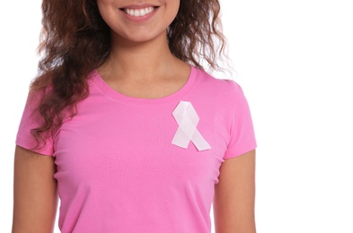 African-American woman with silk ribbon on white background, closeup. Breast cancer awareness concept