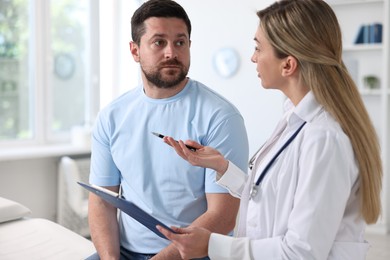 Professional doctor working with patient in hospital