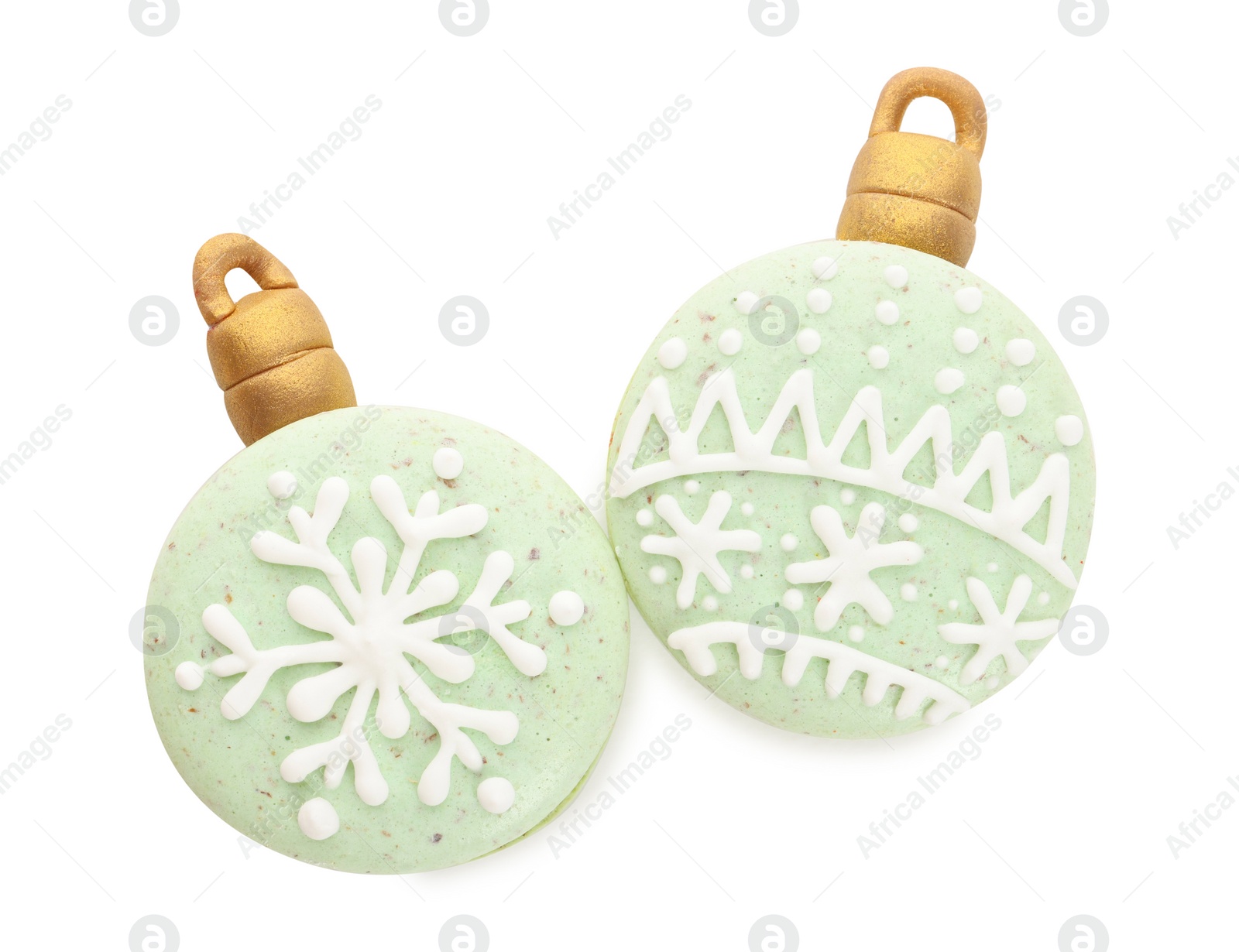 Photo of Beautifully decorated Christmas macarons on white background, top view