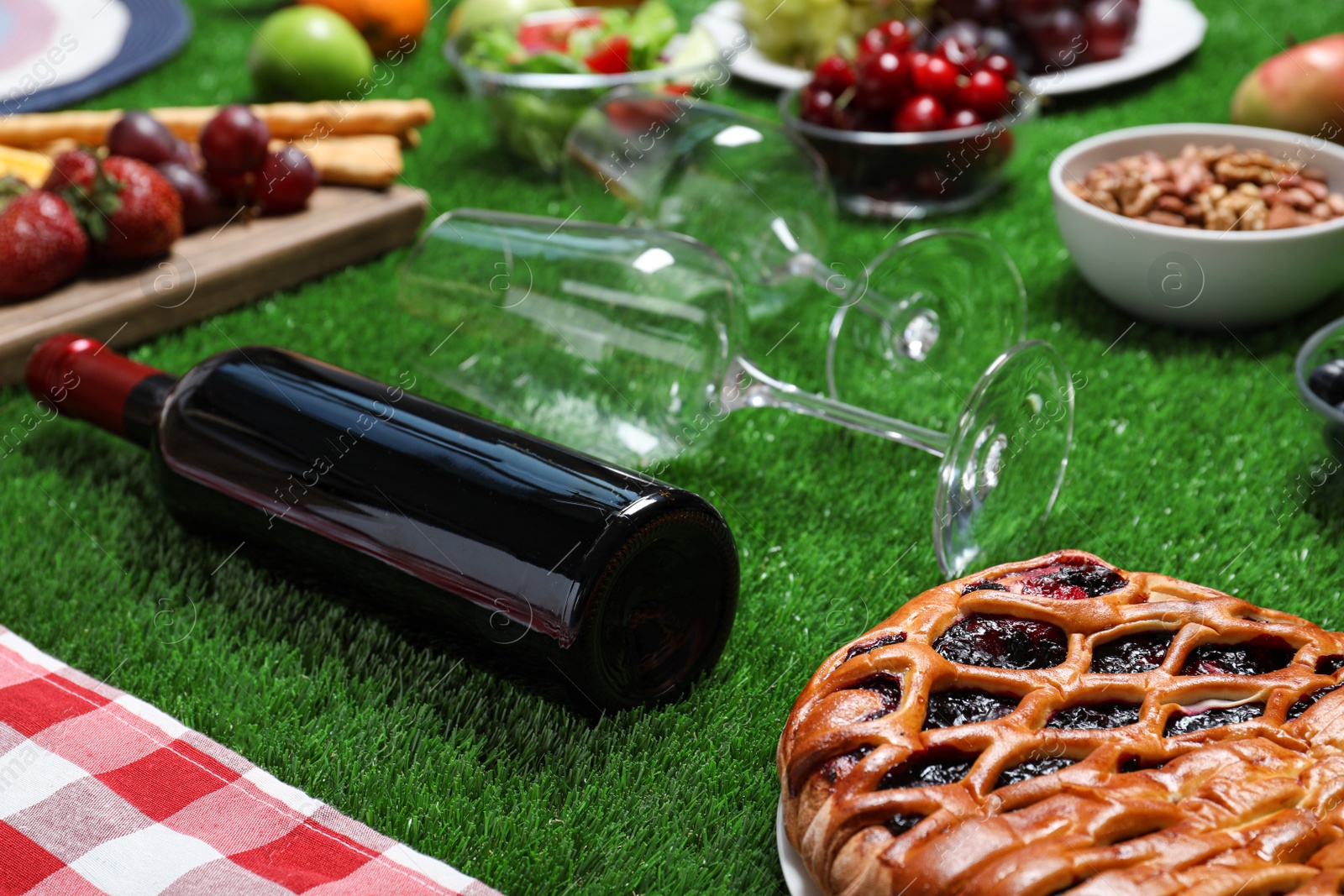 Photo of Many different products on green grass. Summer picnic