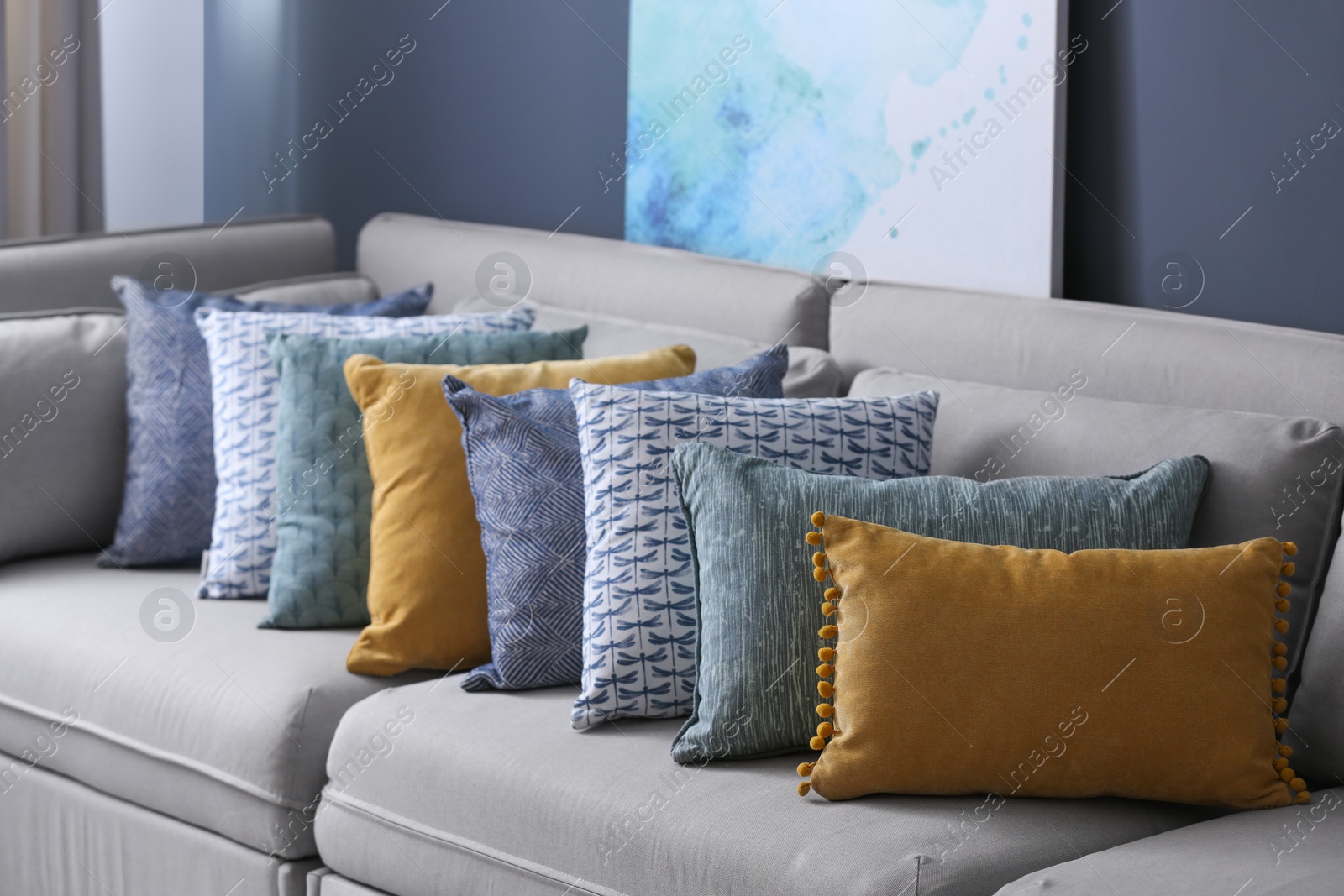 Photo of Sofa with pillows in modern living room interior