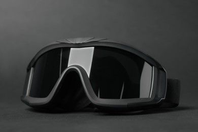 Tactical glasses on black background, closeup. Military training equipment